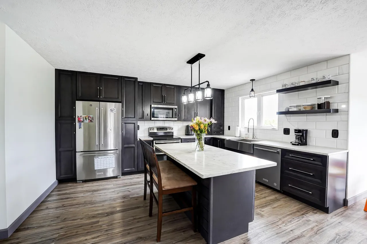 Kitchen remodel with LVP flooring and dark shaker cabinets